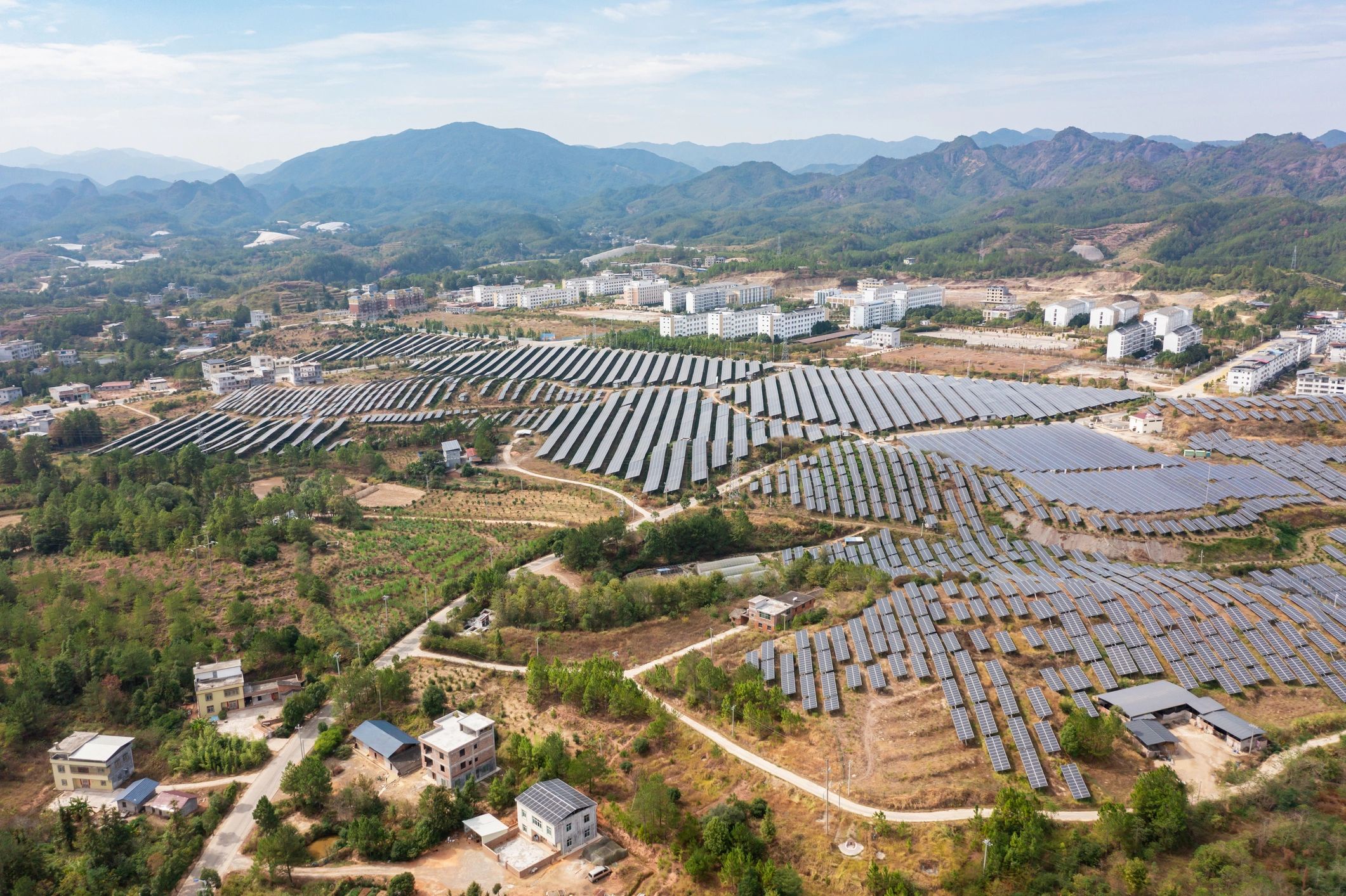 Aerial photography of large solar power plants in modern towns